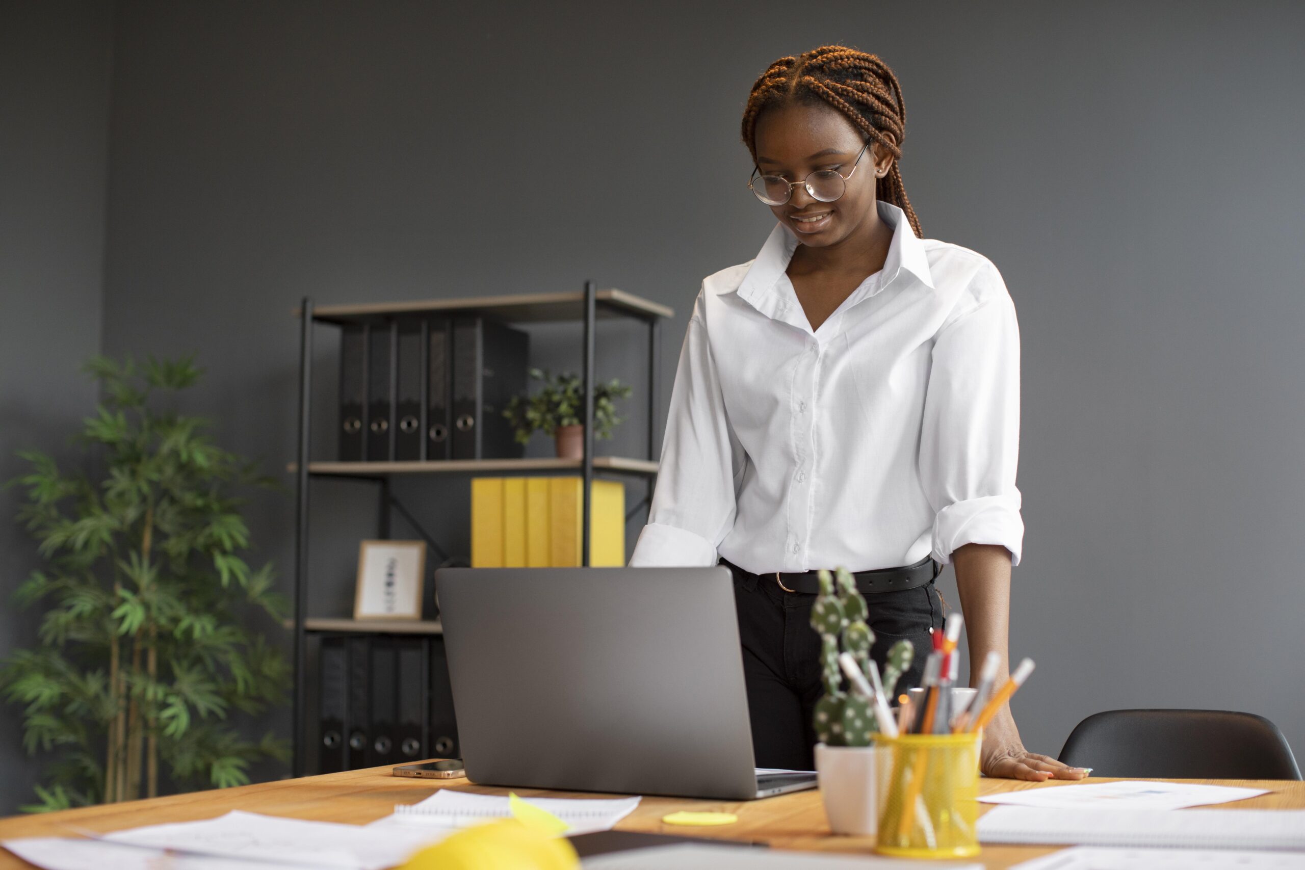 portrait-young-woman-working-her-laptop-startup-company