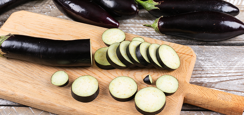 eggplant-chopped-one-cutting-board-wooden-side-view-2